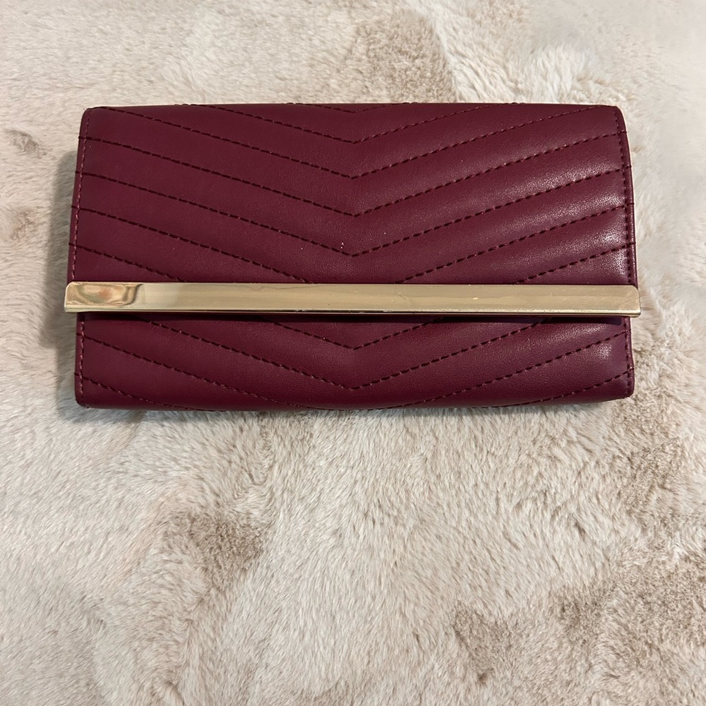 Elegant Burgundy Clutch with Gold Accent